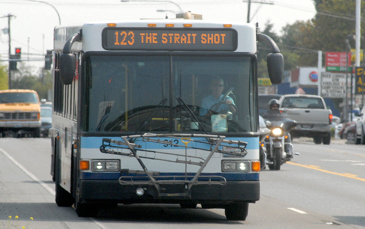 Clallam Transit’s Straight Shot bus makes its way into Port Angeles on Friday on a scheduled run from the ferry terminal on Bainbridge Island. (Keith Thorpe/Peninsula Daily News)