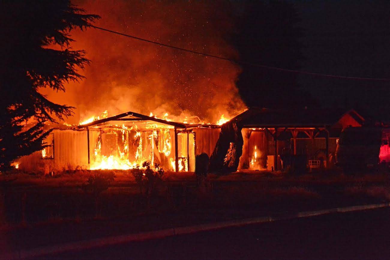 A 5:13 a.m. blaze burned a residential structure at 16th and H streets in Port Angeles Saturday morning. (Jay Cline/Clallam Fire District No. 2)