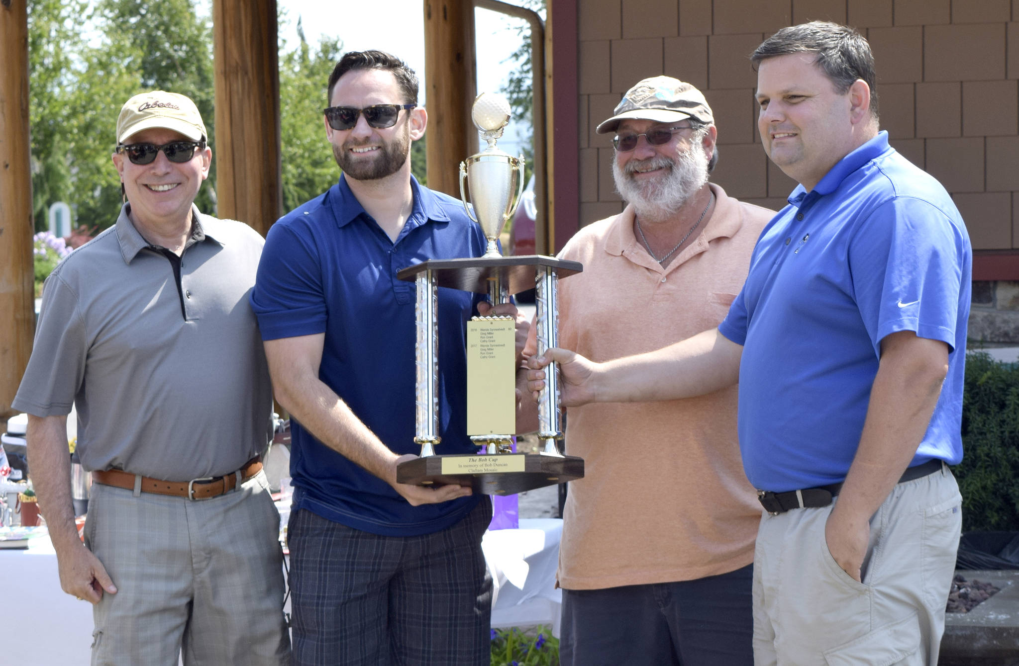 Catherine McKinney/Clallam Mosaic                                The winners of the 2018 Bob Cup are from left, Don Sizemore, Matthew Bumala, Brian Cays and Kalo Vass. The tournament raised more than $20,000 for Clallam Mosaic, a nonprofit that works with individuals with special needs.