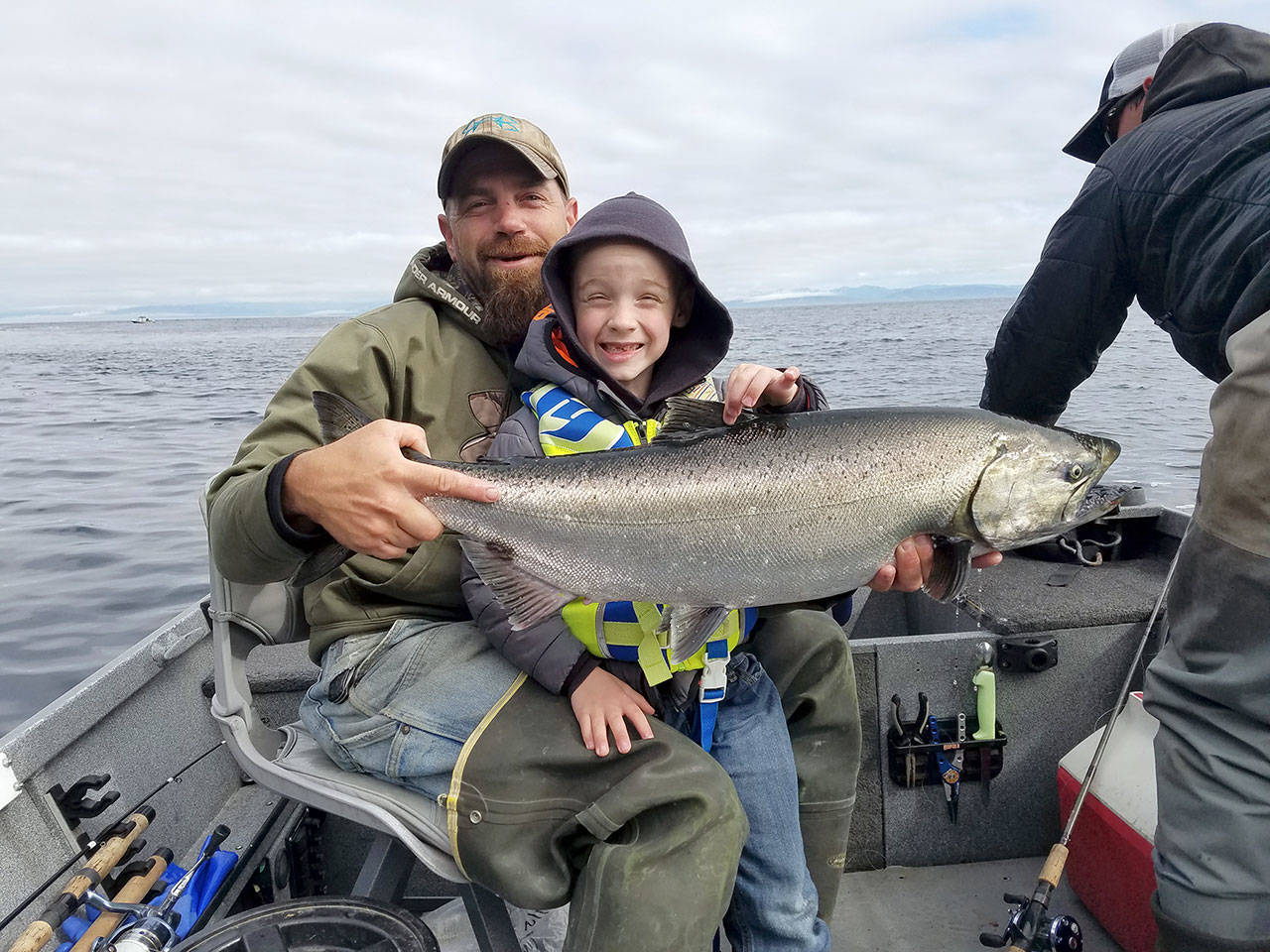 Pete Rosko                                Six-year old Bruce Thomson caught this hatchery chinook with his dad Eric on a 1 1/2 ounce all-glow Kandlefish jig.