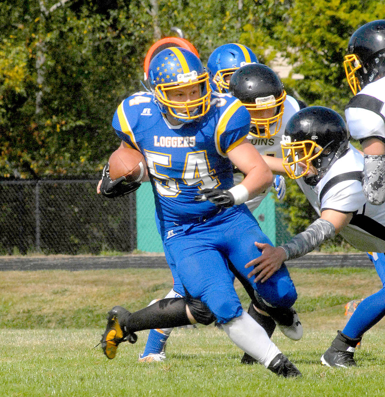 Crescent’s Noah Leonard (54) carries against Clallam Bay during the 2017 season. Leonard finished the season with 1,220 rushing yards and 23 touchdowns and is back for the Loggers this year. (Keith Thorpe/Peninsula Daily News)