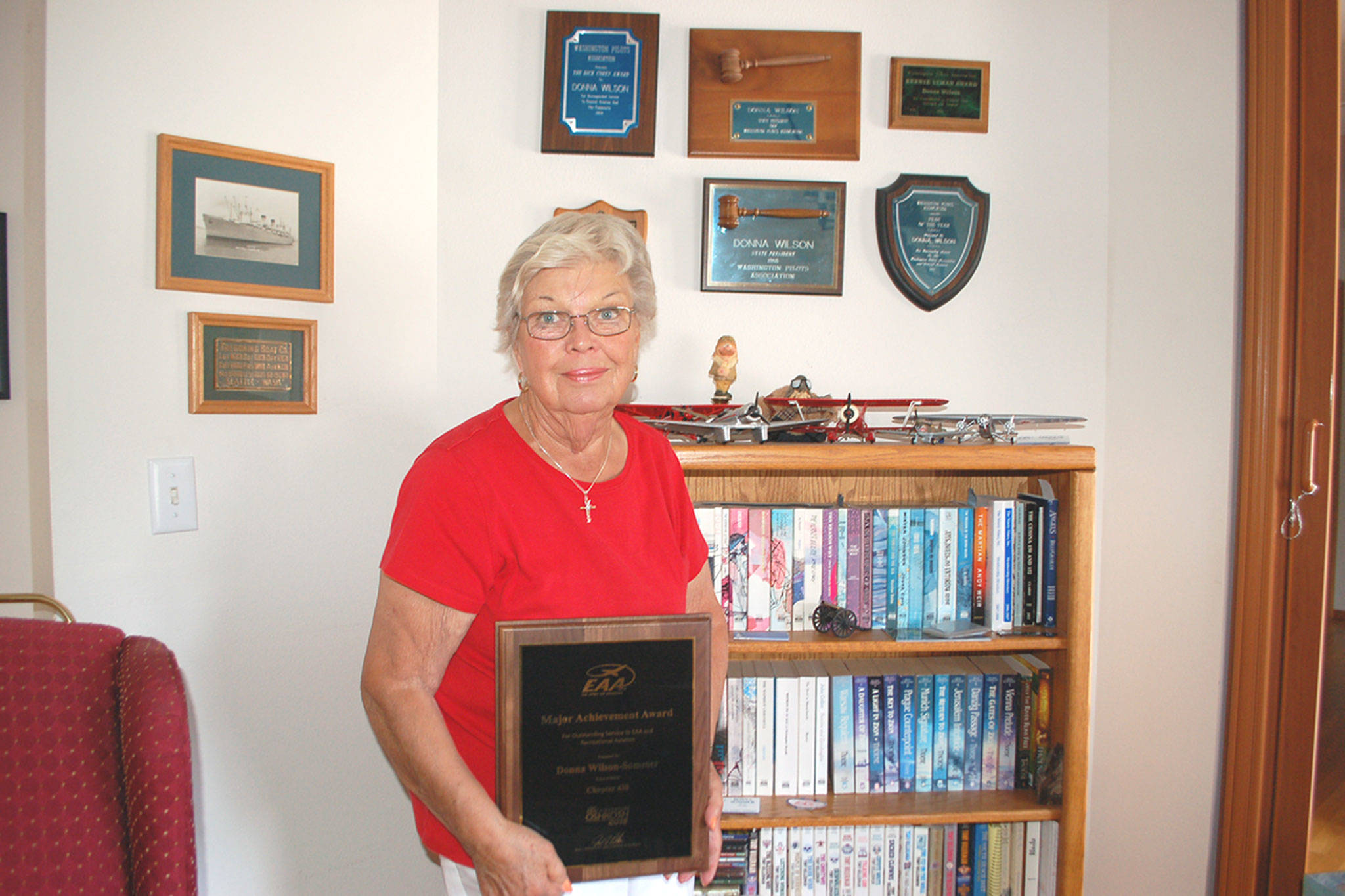 Among a handful of other aviation awards that hang on the walls of her home, Sequim’s Donna Wilson-Sommer is the Experimental Aircraft Association 2018 Major Achievement Award Winner for her many years of promoting aviation in her local communities. (Erin Hawkins/Olympic Peninsula News Group)