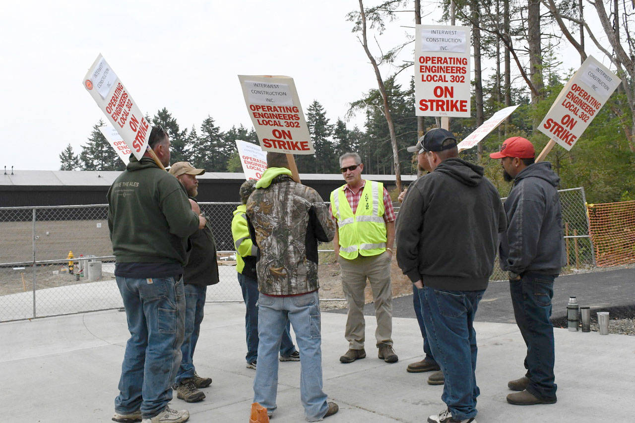 Members of the International Union of Operating Engineers (IUOE) Local 302 are on strike, possibly affecting completion of the Salish Coast Elementary School. (Jeannie McMacken/Peninsula Daily News)