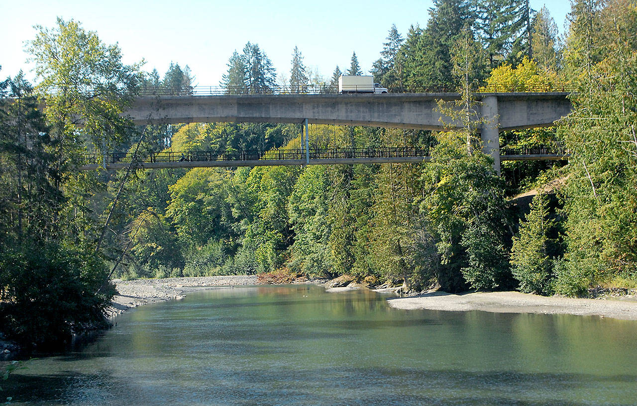 The Elwha River flows Wednesday beneath the Elwha River Bridge west of Port Angeles, not far from the city’s intake for drinking water. Low flow rates on the river have prompted Port Angeles to declare a Stage II water shortage advisory. (Keith Thorpe/Peninsula Daily News)