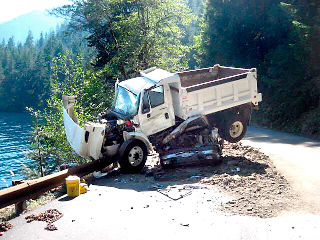 A dump truck landed on top of a pickup truck during a Wednesday wreck on U.S. Highway 101 around Lake Crescent. (Washington State Patrol)