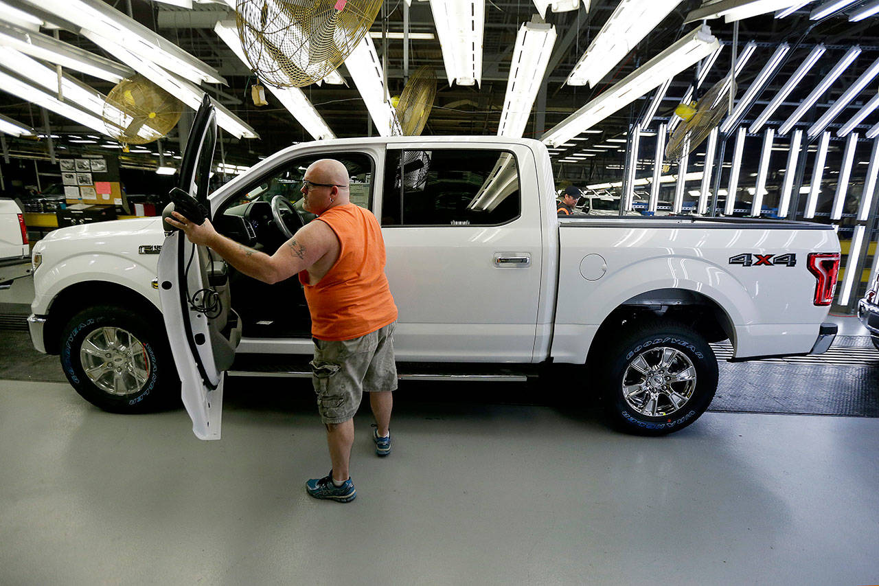&lt;strong&gt;Charlie Riedel&lt;/strong&gt;/The Associated Press                                In this March 13, 2015, file photo a worker inspects a new 2015 aluminum-alloy body Ford F-150 truck at the company’s Kansas City assembly plant.