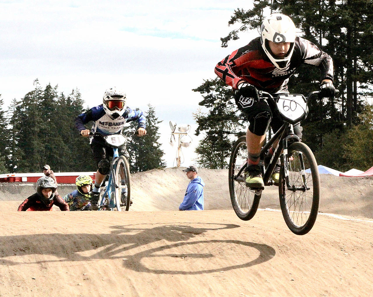 Roughly 500 BMX riders from all around Washington were at Lincoln Park in Port Angeles this weekend for the Washington State BMX championships. On Sunday were the state championship triple-point races. Here, Joseph Ritchie of Port Angeles (No. 60), leads a pack of racers in the age 12 cruiser division. No. 51 Is Malcolm Evans from Bellingham. For results, be sure to check the sports section of the Peninsula Daily News on Tuesday. (Dave Logan/Peninsula Daily News)