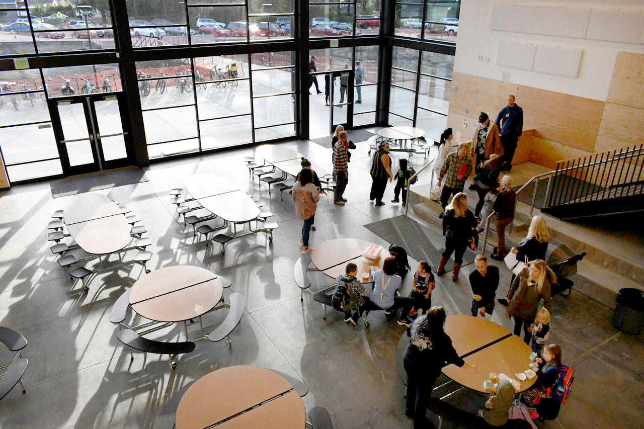 Salish Coast Elementary School features a lot of glass to let in the light and a bit of solar heating. The cafeteria area/gathering place welcomed students and parents who took time for a quick snack before classes began Tuesday morning. (Jeannie McMacken/Peninsula Daily News)