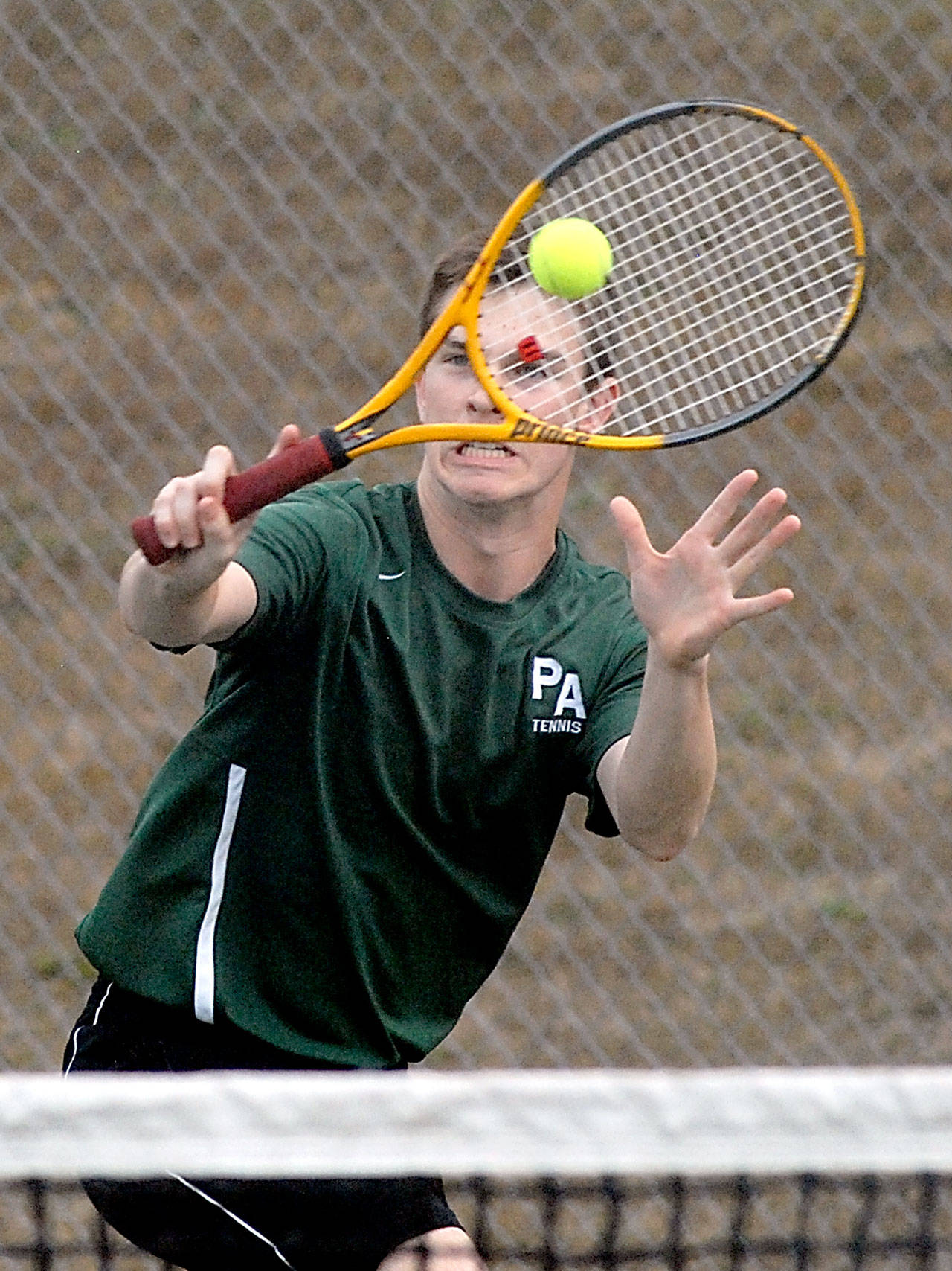 Keith Thorpe/Peninsula Daily News Port Angeles’ Milo Whitman goes for the return during his doubles match with partner Bo Bradow against North Kitsap’s Ryland Schmidt and Logan Chmielewski on Wednesday at Port Angeles High School.