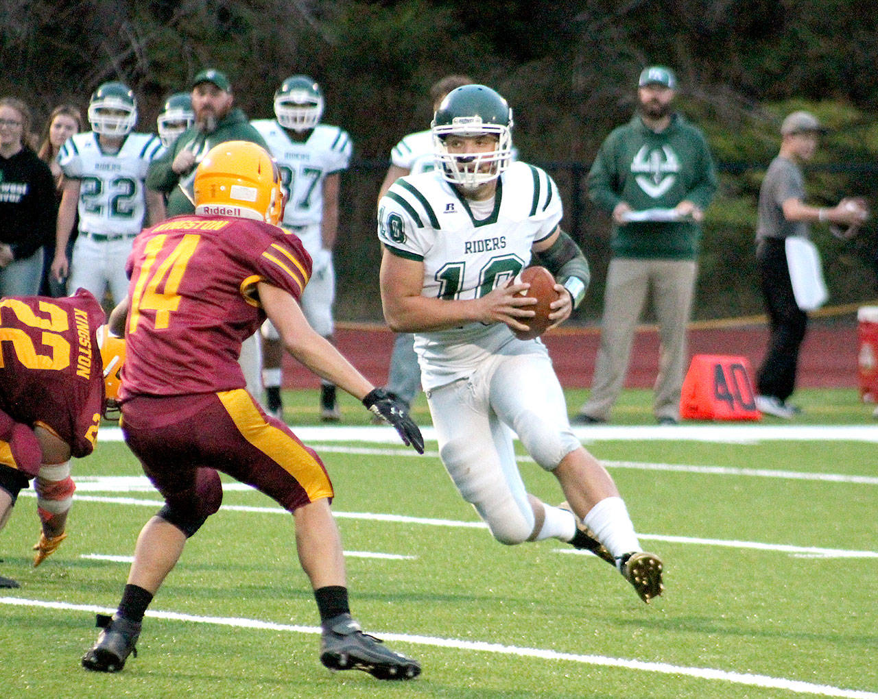Port Angeles Brenden Roloson-Hines runs with the ball against Kingston. The Roughriders won the game 28-6 for their first win of the year. (Mark Krulish/Kitsap News Group)