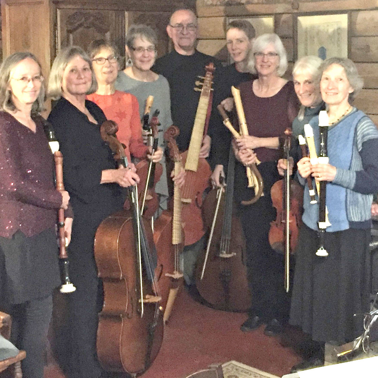 Barbra Tusting, Gretchen Cooper, Kristin Smith, Dahti Blanchard, Lee Inman, Martha Breunig, Louise Huntingford, Marcy Stewart and Bea Dobyns and prepare for the upcoming Candlelight Concert.