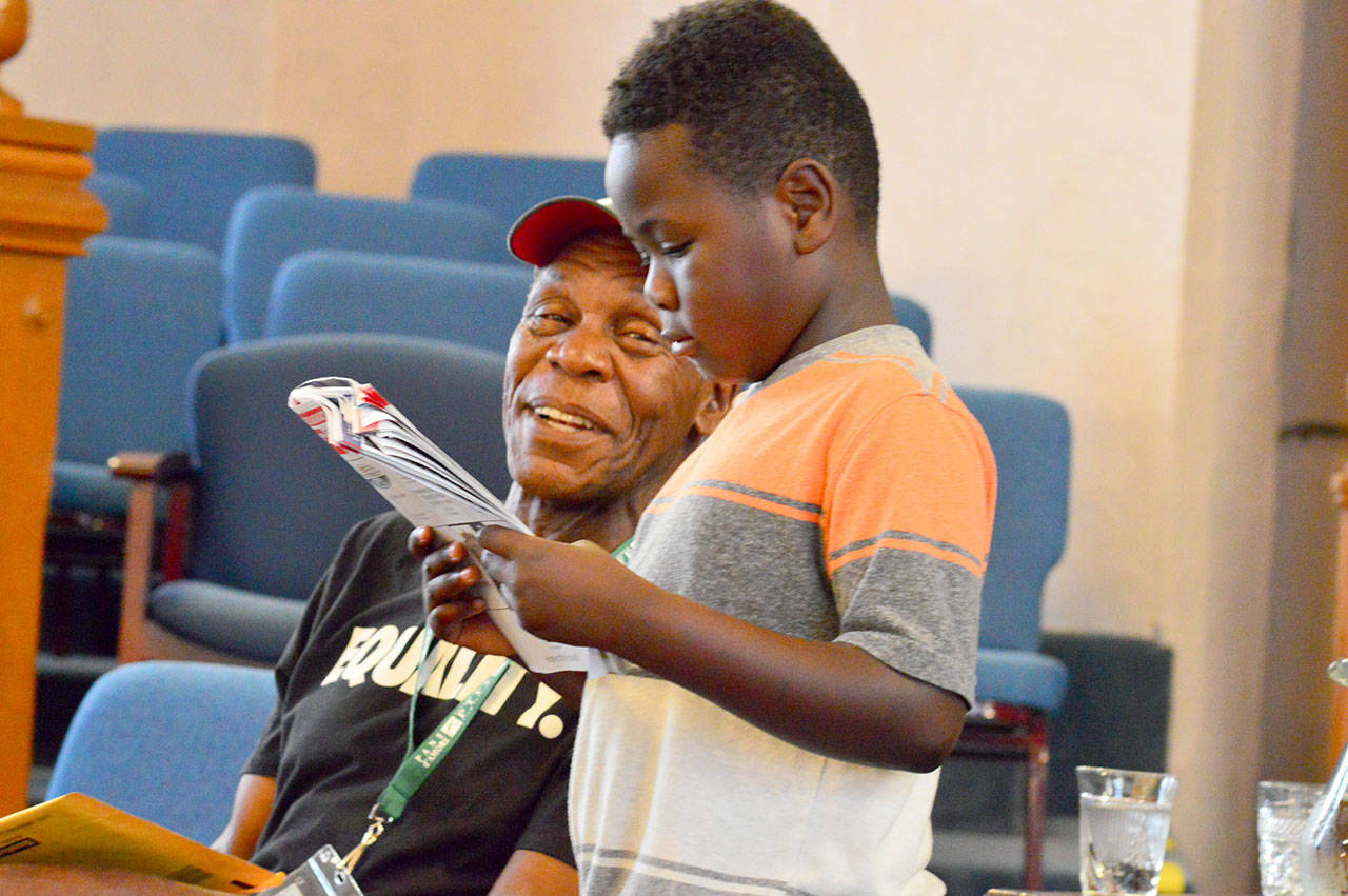 Kasongo Thompson, 5, a native of the Democratic Republic of Congo who lives with his parents in Port Ludlow, met Danny Glover at the Port Townsend Film Festival on Friday. (Diane Urbani de la Paz/for Peninsula Daily News)