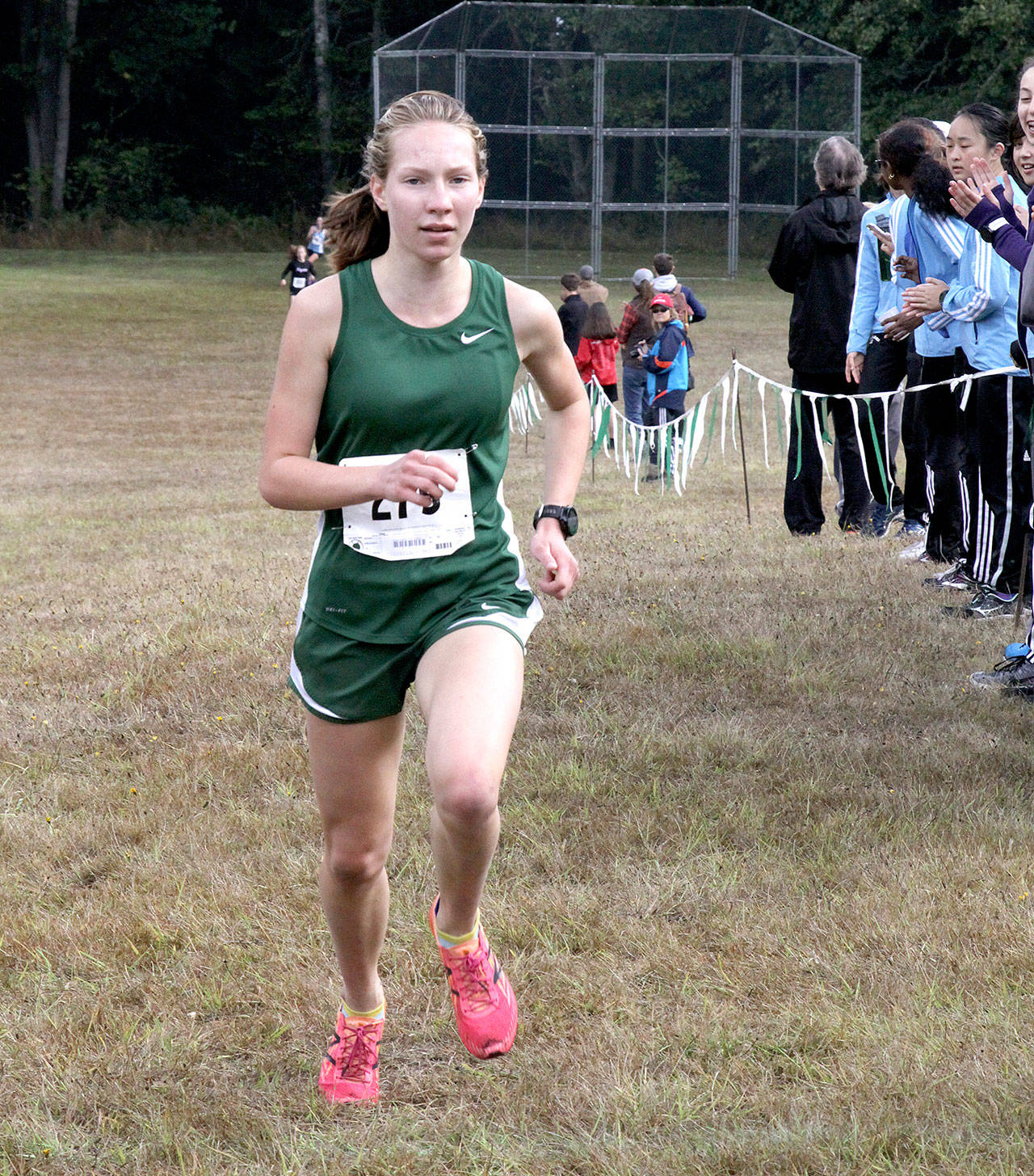 Dave Logan/for Peninsula Daily News Port Angeles’ Lauren Larson wraps up a win at the Salt Creek Invitational earlier this month. The Washington State Cross Country Coaches Association ranked the Roughriders’ girls team No. 1 in Class 2A this week.