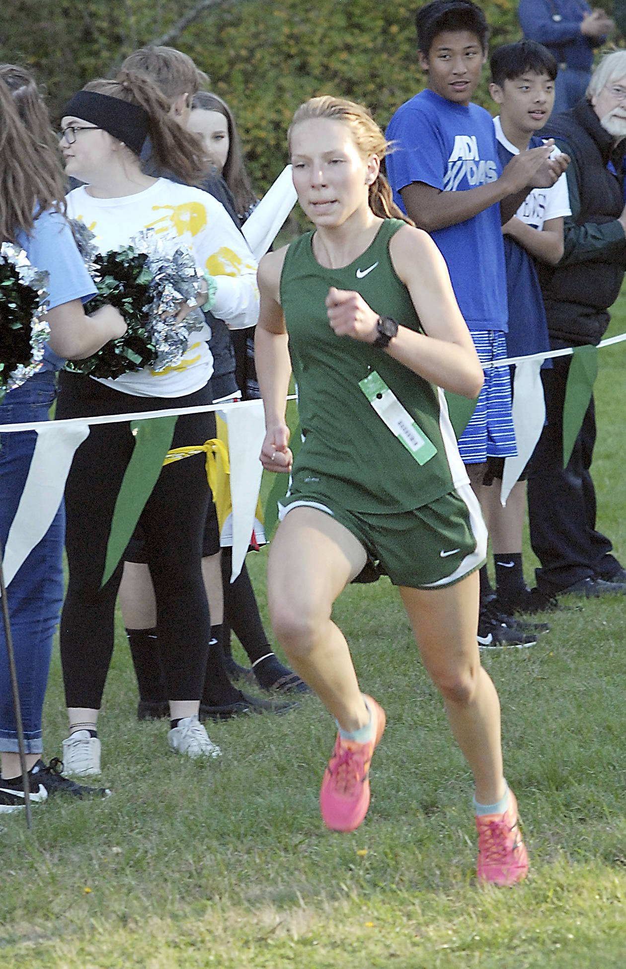 <strong>Keith Thorpe</strong>/Peninsula Daily News                                 Lauren Larson of Port Angeles finishes far ahead of the next closest competitor during the girls cross-country race on Wednesday at Lincoln Park.