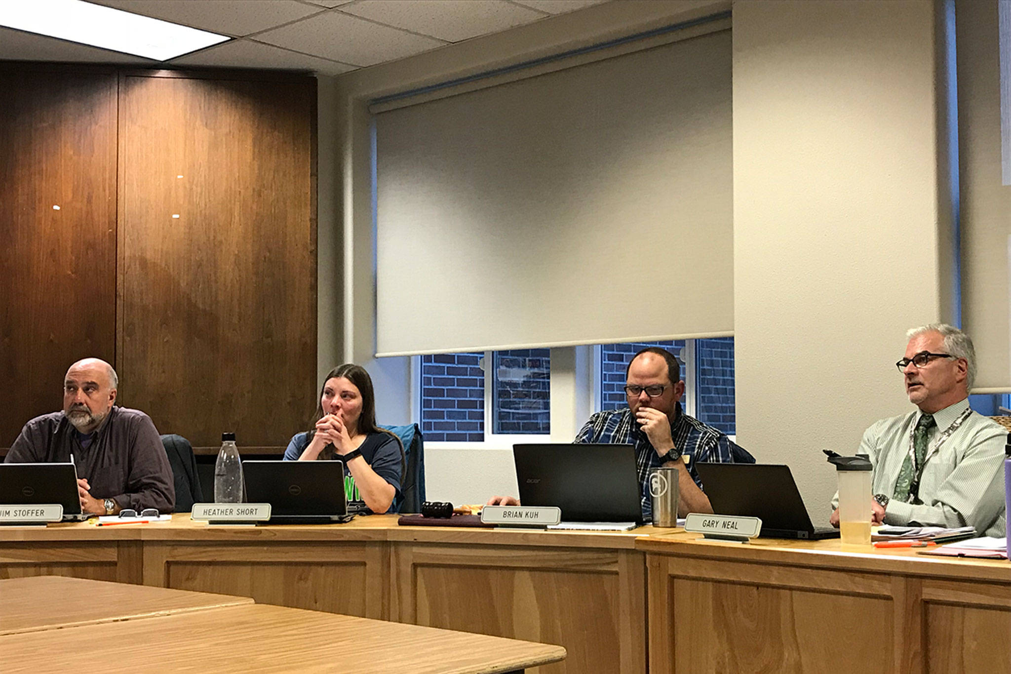 &lt;strong&gt;Erin Hawkins&lt;/strong&gt;/Olympic Peninsula News Group                                Sequim School Board members from left, Jim Stoffer, President Heather Short and vice president Brian Kuh and Superintendent Gary Neal listen as classified staff speak out about contracts at the board meeting Monday.