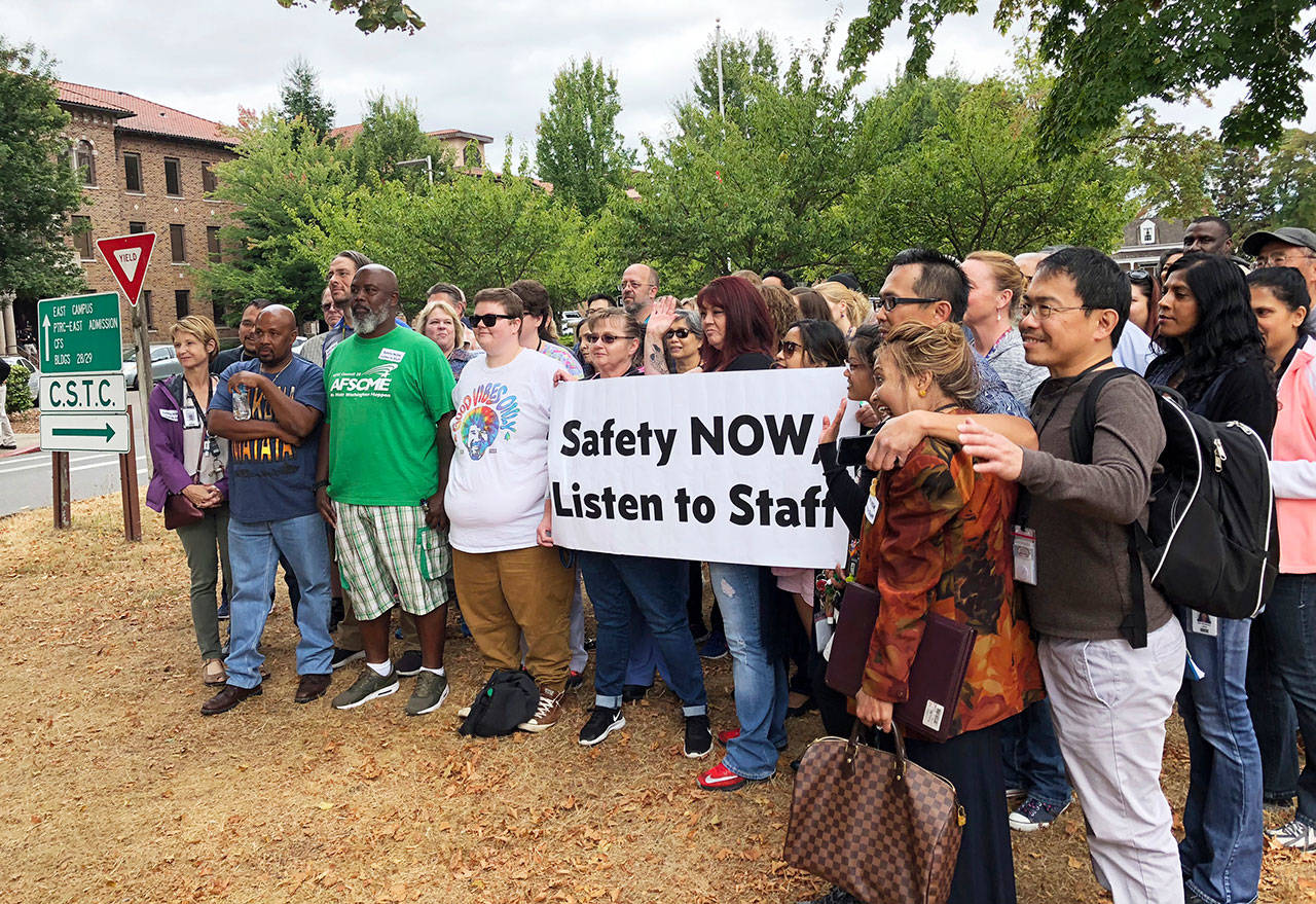 Workers rally Aug. 30 demanding changes to the way officials assign dangerous patients to wards at Western State Hospital in Lakewood. (Martha Bellisle/The Associated Press)