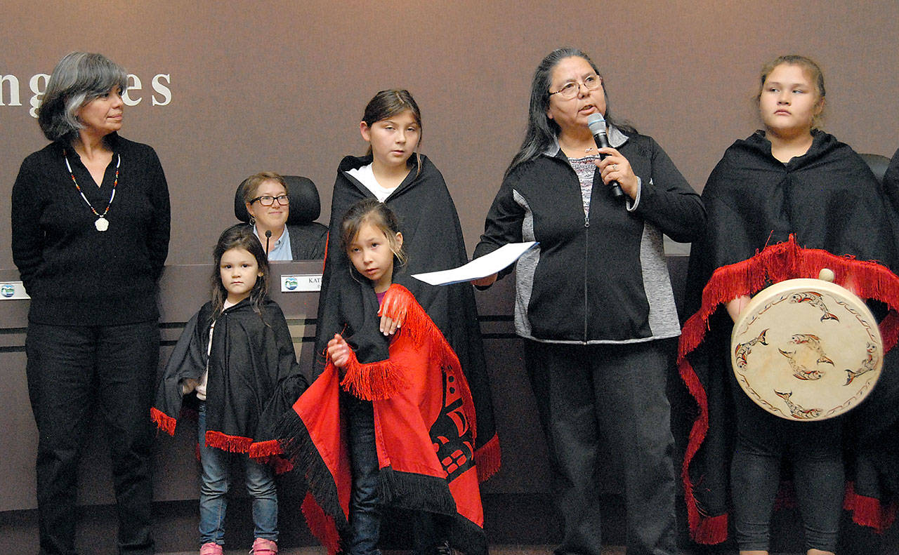 Lower Elwha Klallam Tribe Chairwoman Frances Charles, second from right, speaks about her tribe’s long-standing relationship with the city of Port Angeles after hearing a proclamation read Tuesday by Port Angeles Mayor Sissi Bruch, left, calling for Oct. 8 to be Indigeneous Peoples Day. Among the children taking part in the ceremony were, from left, Khyla Miller, 4, Zoey Henderson, 7, Malena Marquez, 11 and Shawnee Tom, 11. Seated at rear is Deputy Mayor Kate Dexter. (Keith Thorpe/Peninsula Daily News)