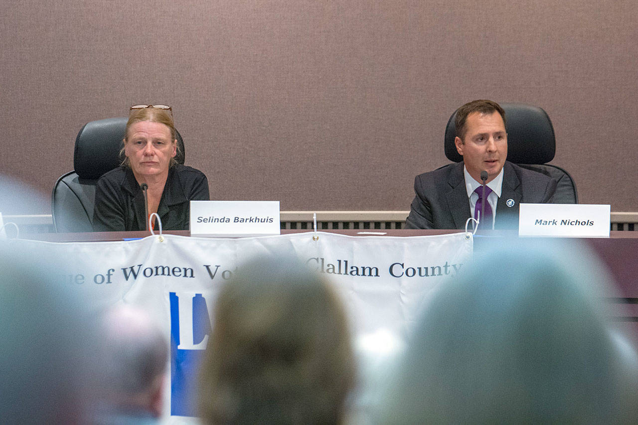 Candidates for Clallam County prosecuting attorney Selinda Barkhuis and incumbent Mark Nichols answered questions during a League of Women Voters forum Wednesday. (Jesse Major/Peninsula Daily News)
