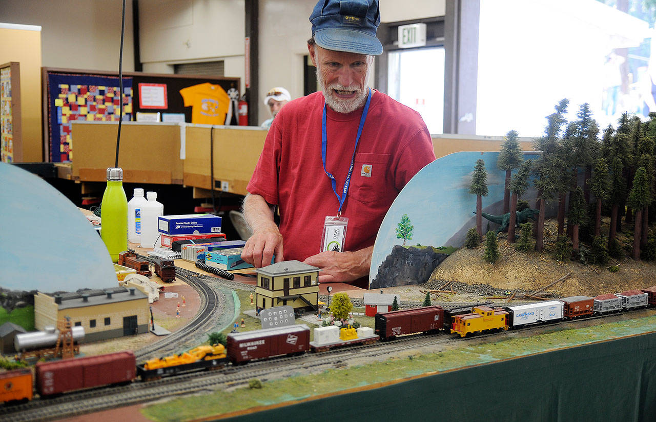 Dave Anderson with the North Olympic Peninsula Railroaders runs a train during the Clallam County Fair in August. The club returns to the fairgrounds Saturday and Sunday for its Train Show & Swap Meet with more trains and vendors. (Michael Dashiell/Olympic Peninsula News Group)