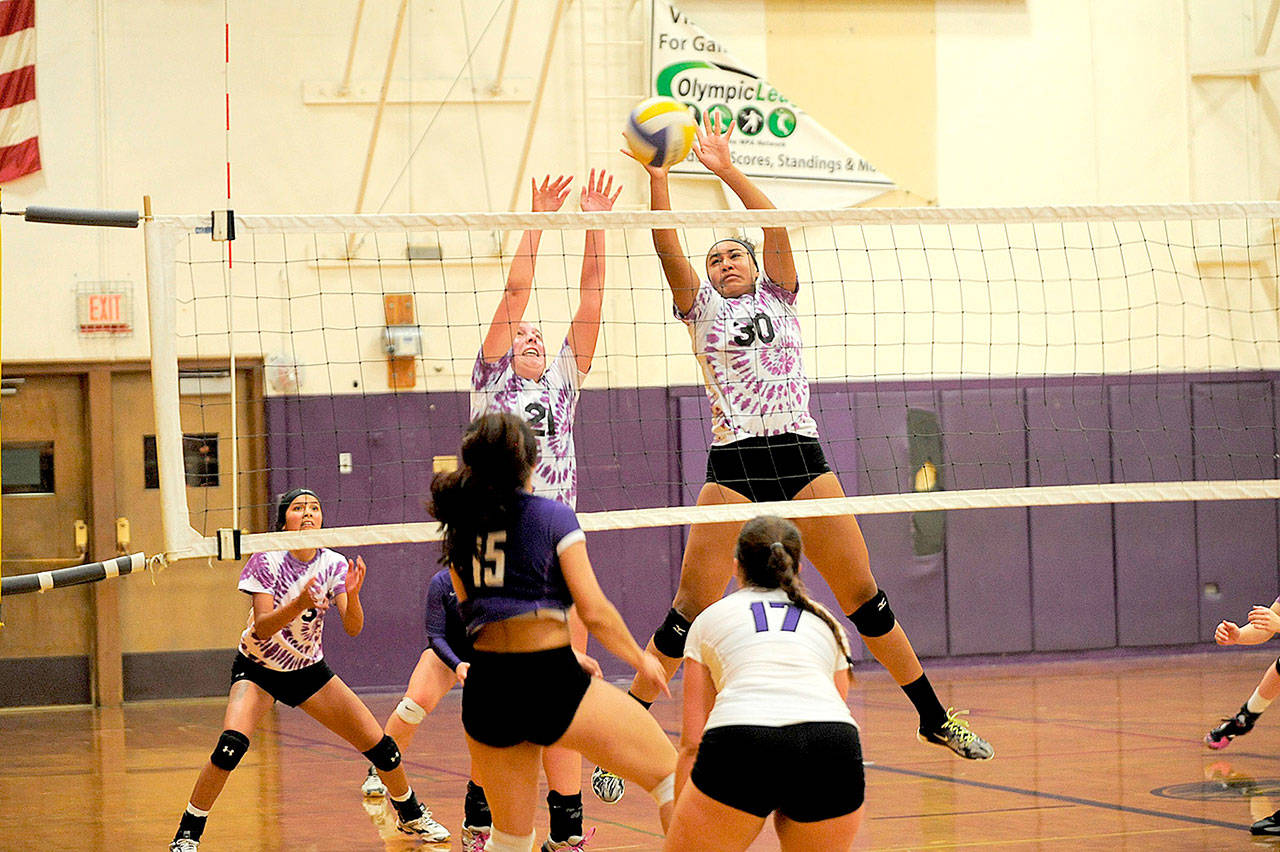 Sequim’s Kalli Wiker and Jayla Julmist battle at the net against the No. 1-ranked North Kitsap Vikings. The Wolves gave the Vikings all they could handle in a 3-2 loss. (Matthew Nash/Olympic Peninsula News Group)