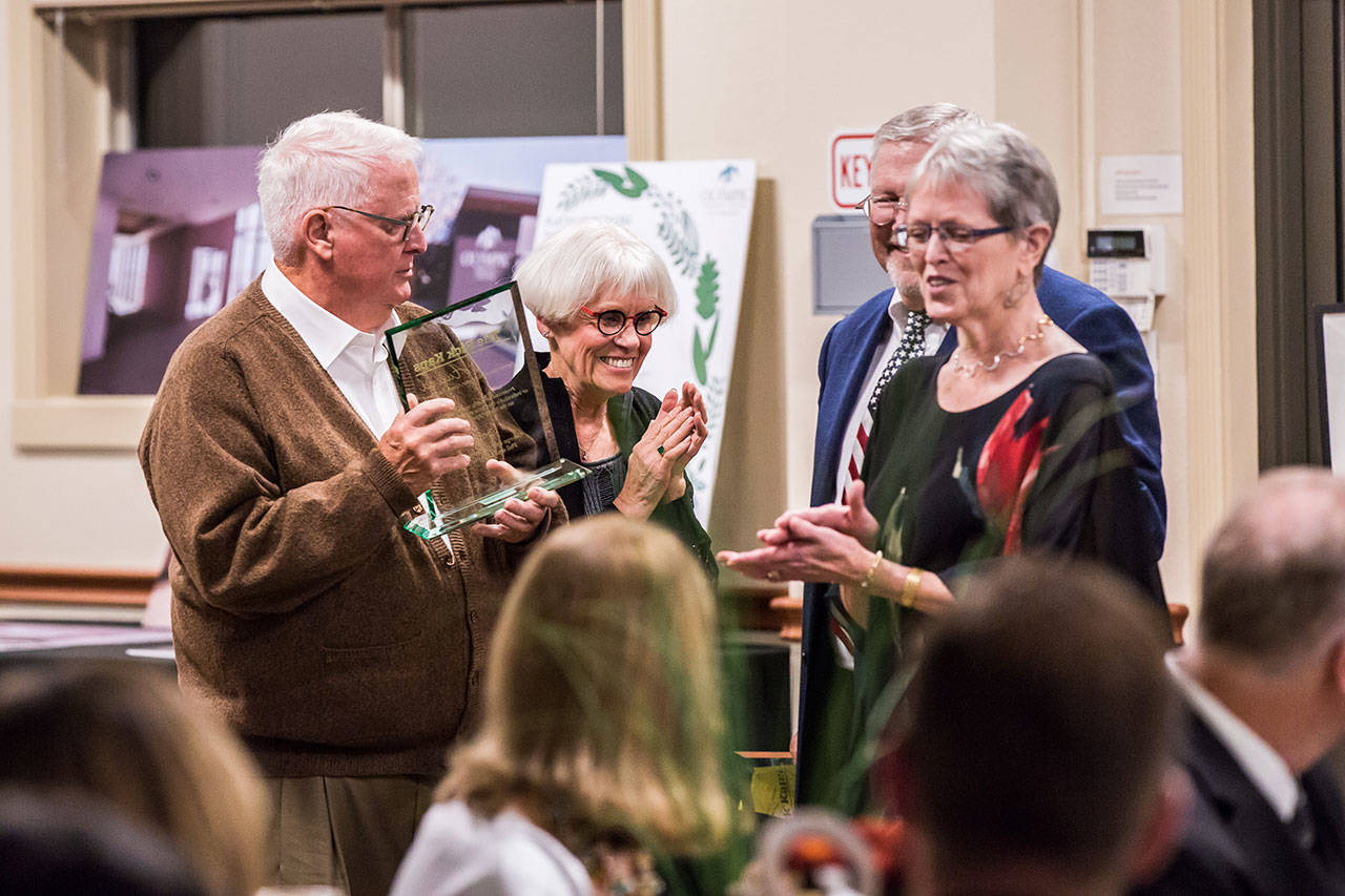 Recipients of the Rick Kaps award, given annually to outstanding Olympic Medical Center Cancer Center supporters, enjoy the Harvest of Hope dinner at Guy Cole Event Center in Sequim. From left are George and Barbara Brown, and Phil (partially obscured) and Linda Walker.