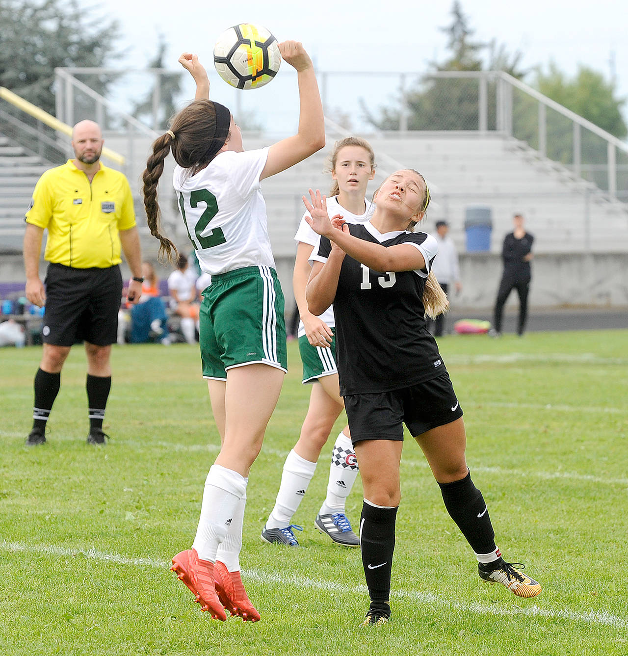 Michael Dashiell/Olympic Peninsula News Group Port Angeles’ Delaney Wenzl, center back, is always close to the action for the Roughriders in her role as the team’s ‘utility infielder.’ Wenzl and Port Angeles open the district tournament Saturday in Tacoma.