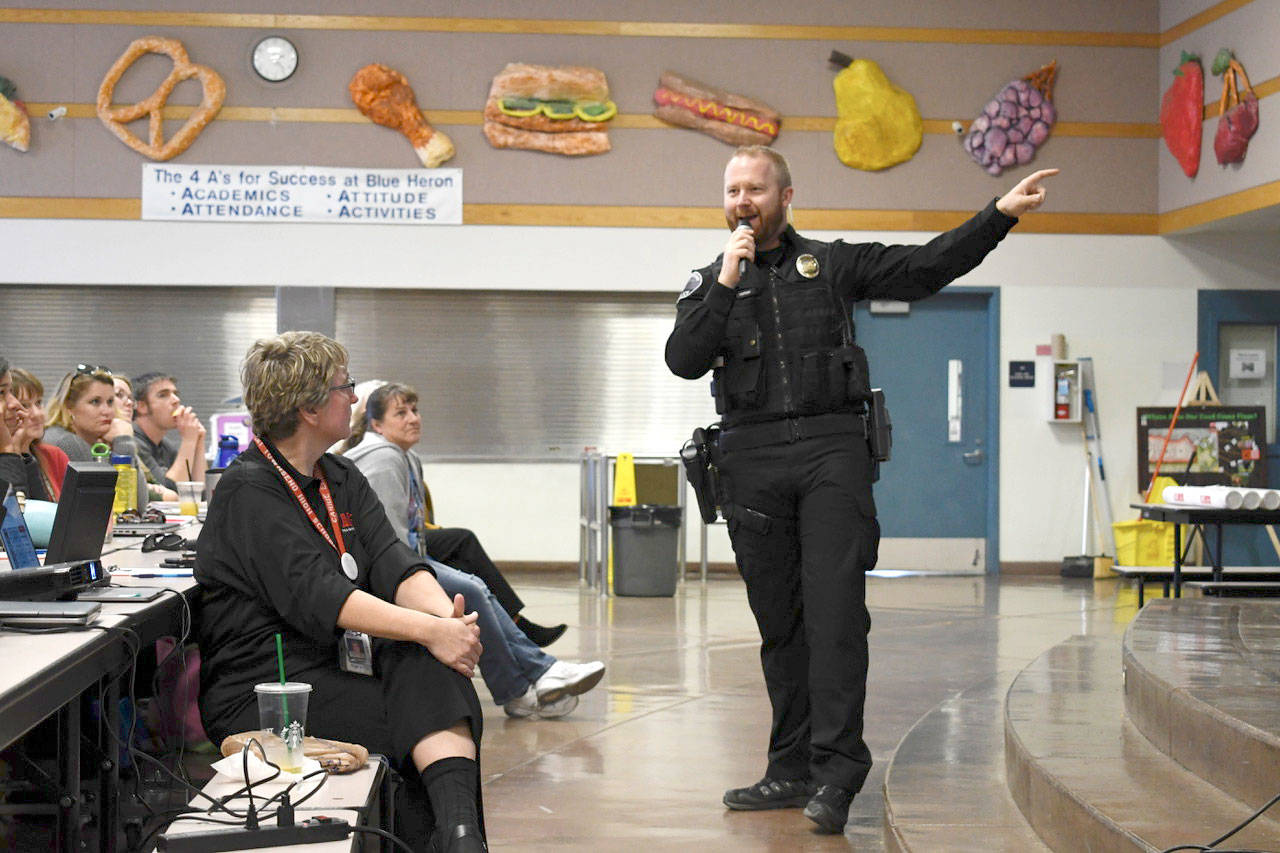 Port Townsend police officer and school resource officer Jeremy Vergin presented the first ALICE training module for all teachers, staff and administrators Wednesday at Blue Heron Middle School. The active shooter training is being provided to the entire district. (Jeannie McMacken/ Peninsula Daily News)