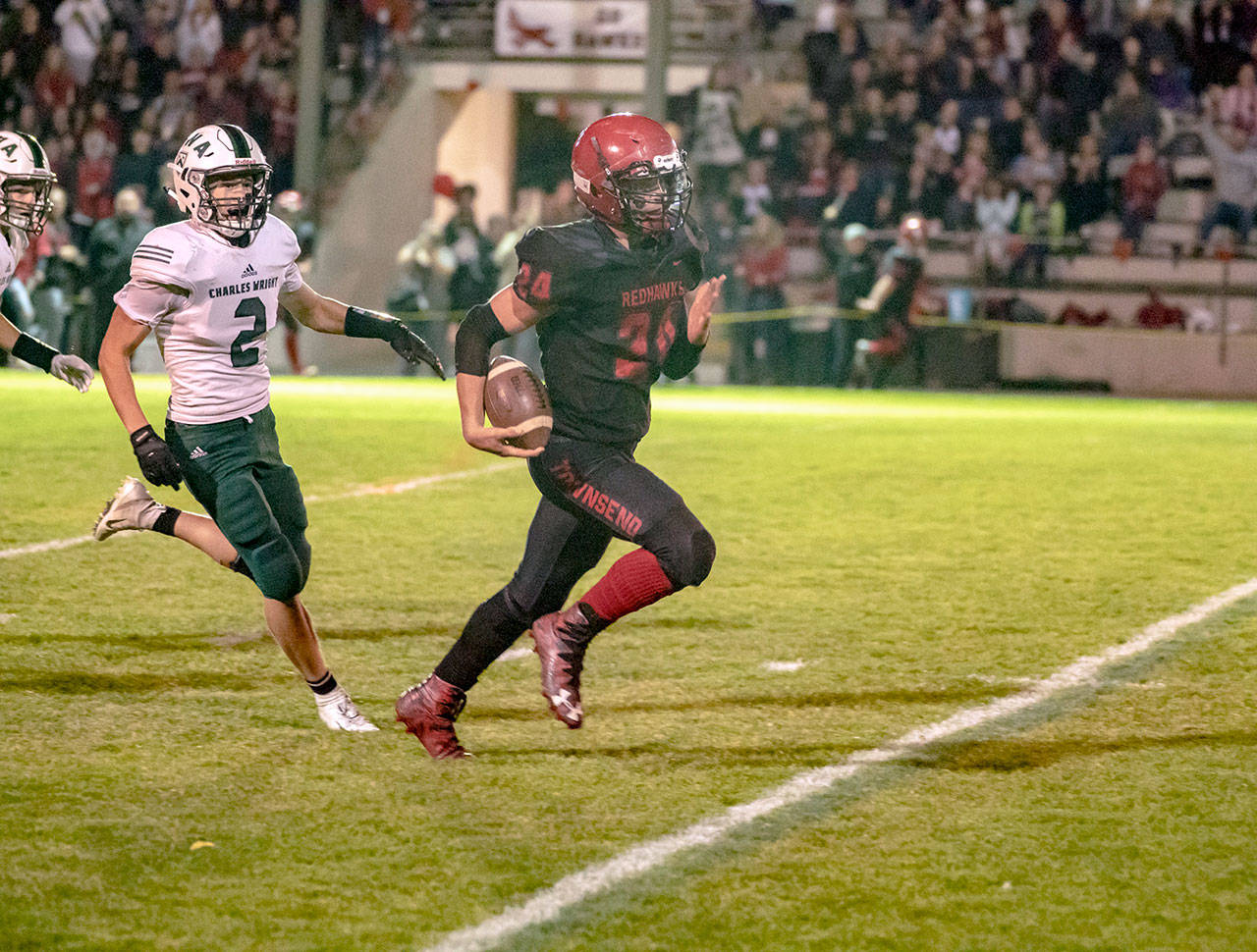 Steve Mullensky/for Peninsula Daily News Port Townsend’s Dylan Tracer runs past the final Charles Wright defender on his way to a 99-yard kickoff return touchdown during a win earlier this season.