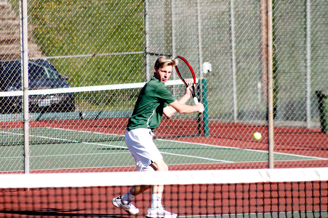 Mark Krulish/Kitsap News Group Port Angeles’ Hayden Woods returns a shot during the first day of play at the Olympic League 2A Boys Tennis Championships at North Kitsap High School on Wednesday.