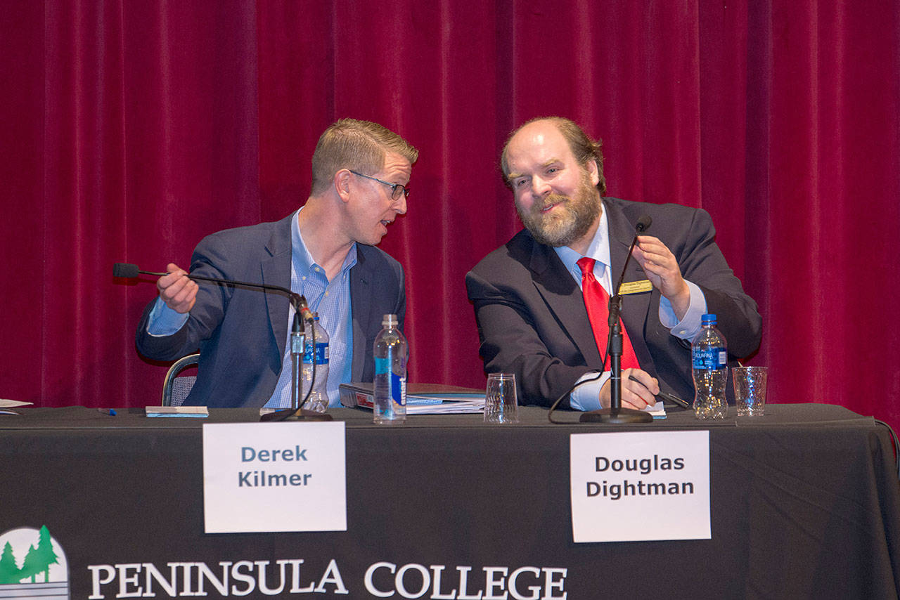 U.S. Rep. Derek Kilmer, left, talks with his challenger Douglas Dightman after a League of Women Voters forum at the Peninsula College Little Theater. (Jesse Major/Peninsula Daily News)