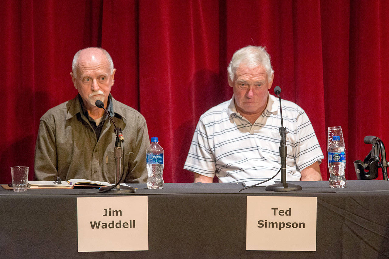 Clallam County Public Utility District candidates Jim Waddell, left, and incumbent Ted Simpson answer questions during a League of Women Voters forum. (Jesse Major/Peninsula Daily News)