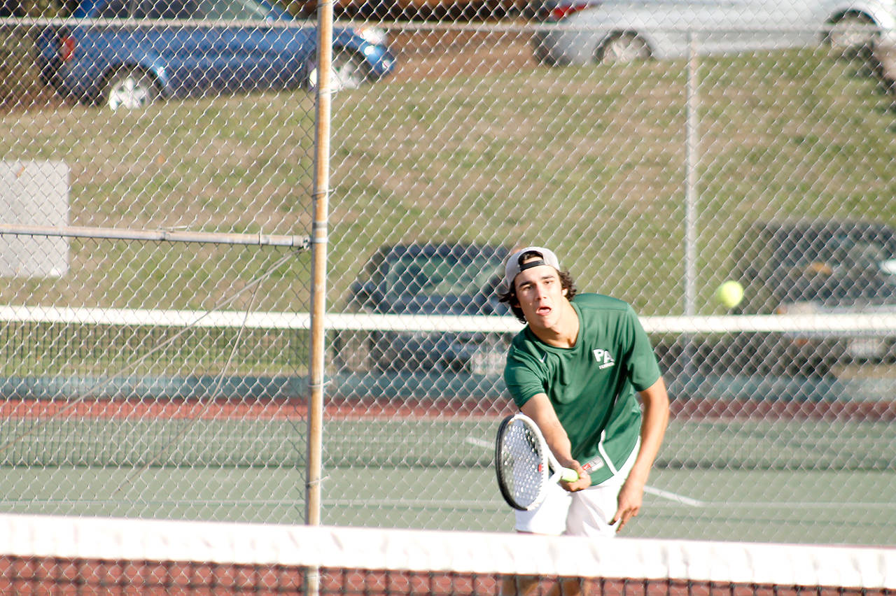 Mark Krulish/Olympic Peninsula News Group Port Angeles’ Bo Bradow prepares to return a shot during a doubles match with his partner Milo Whitman. The duo finished third at the Olympic League Boys Tennis Tournament at North Kitsap High School on Thursday. They will play next week at the district tournament.