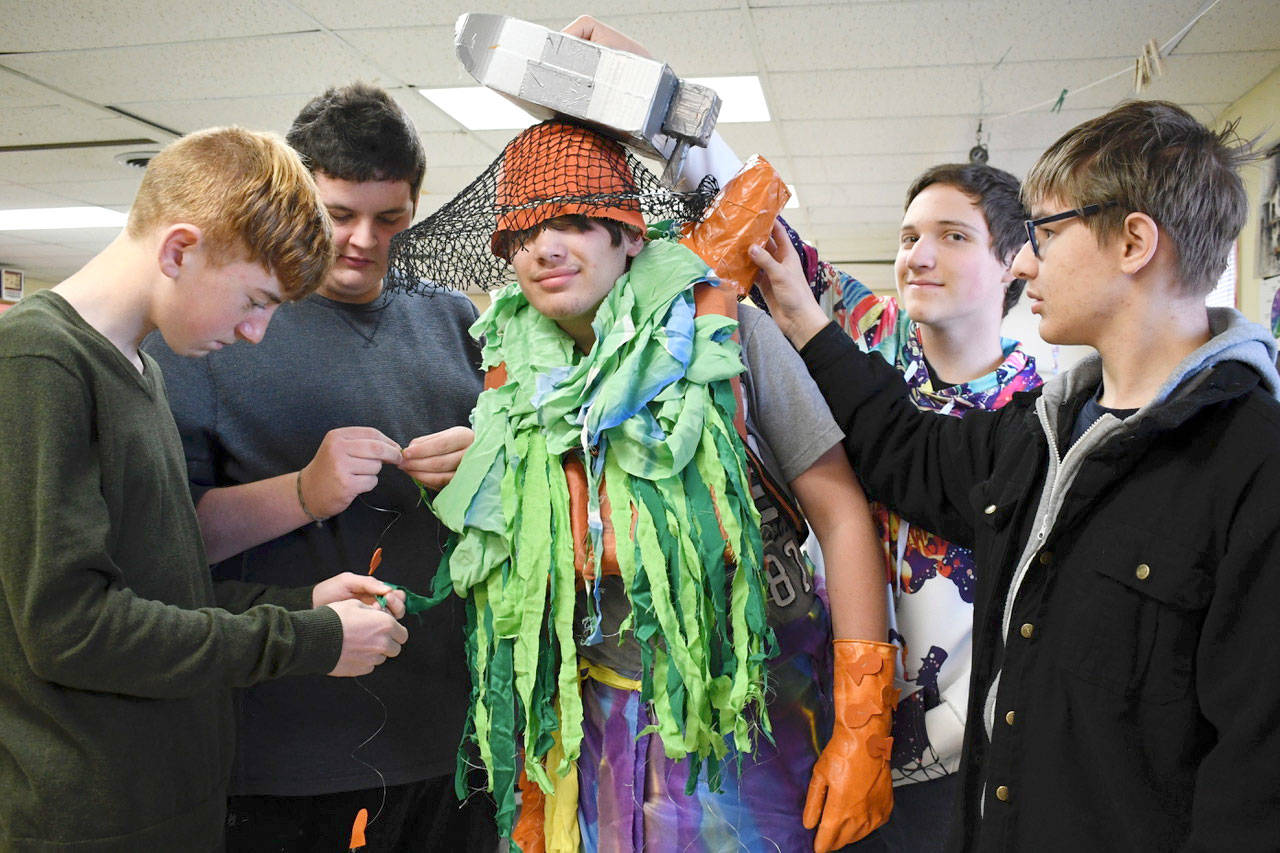 Five Port Townsend high school students collaborated to create “Depths of the Ocean,” a wearable art piece. The creative expression includes a boat, fish caught on fishing line and netting. Artists include, from left, Mark Anderson, ninth grade; Matthew McColl, 11th grade; model Owen Smith, 10th grade; Maximus Villagran, 10th grade; and Chris Lott, ninth grade. The students plan to be part of the Port Townsend Wearable Art Student Show on Nov. 3 at Key City Public Theatre. (Jeannie McMacken/Peninsula Daily News)