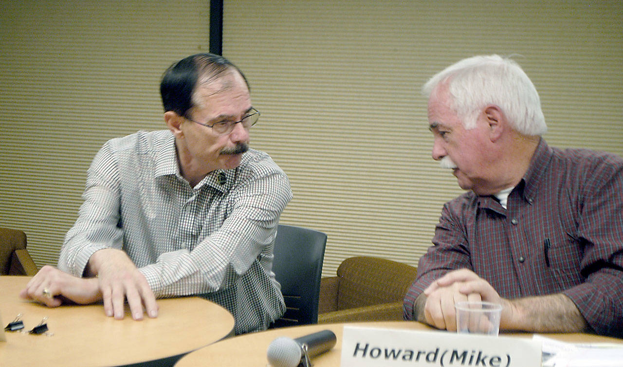 Clallam County commissioner candidates Bill Peach, left, and Mike Doherty chatted last week before their debate for the Port Angeles-West End District 3 position. (Paul Gottlieb/Peninsula Daily News)