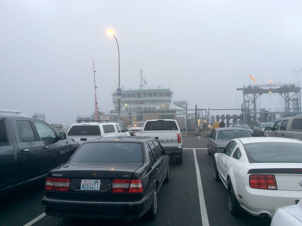 Ferry passengers and cars wait in the fog to board the MV Kennewick at Port Townsend on Sunday. (Mark Swanson/Peninsula Daily News)