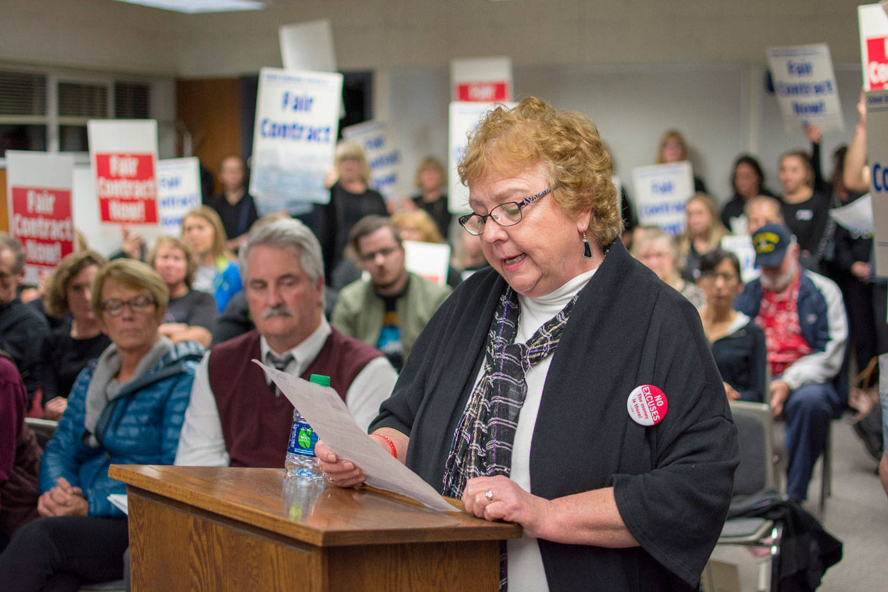 Barb Gapper, lead negotiator for the Port Angeles Paraeducator Association, reads a letter to the Port Angeles School District board during its recent meeting. (Jesse Major/Peninsula Daily News)