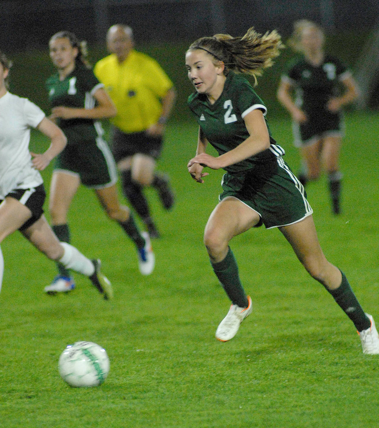 Keith Thorpe/Peninsula Daily News Port Angeles freshman Catie Brown pushes the ball up the field earlier this season. Brown and a stable of talented freshman have the Roughriders in search of a third straight trip to the state tournament.