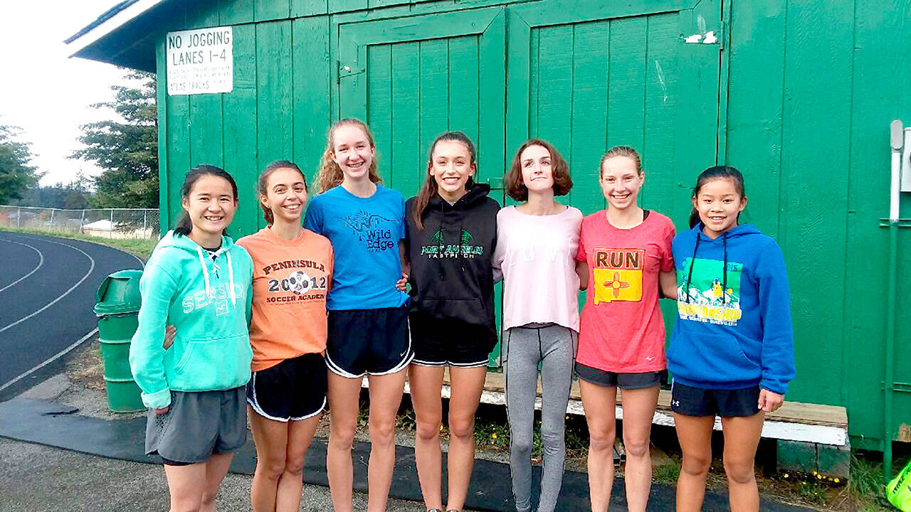 Pierre LaBossiere/Peninsula Daily News The two-time District III champion Port Angeles girls’ cross-country team will be looking to place at state Saturday in Pasco. Fromleft are Kathryn Guttormsen, Kynzie DeLeon, Emma Weaver, Ella Holland, Kaylee Helgesen, Lauren Larson and Jenna McGoff.