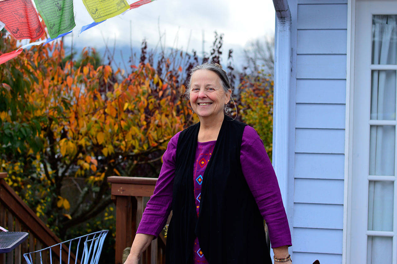 Kate McDermott revels in her queendom: her Port Angeles backyard. (Diane Urbani de la Paz/for Peninsula Daily News)