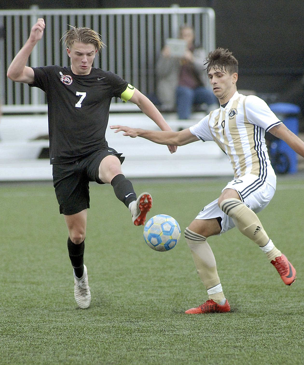&lt;strong&gt;Keith Thorpe&lt;/strong&gt;/Peninsula Daily News                                Pierce’s Austin Stafford, left, and Peninsula’s Manuyel Galiano dance around a loose ball during Wednesday’s NWAC first-round playoff game at Wally Sigmar Field in Port Angeles.