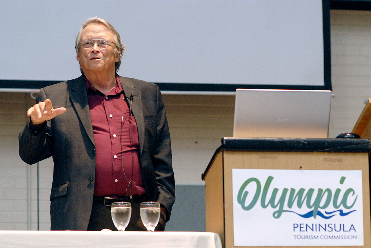 Jonathan Tourtellot, CEO of National Geographic’s Destination Stewardship Center, delivers a keynote address on geotourism during Thursday’s Olympic Peninsula Tourism Summit at Vern Burton Community Center in Port Angeles. (Keith Thorpe/Peninsula Daily News)