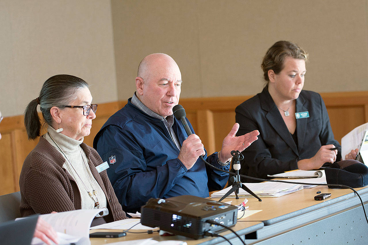 From left, Jefferson County Commissioners Kathleen Kler, David Sullivan and Kate Dean discuss a shooting range ordinance during a special meeting Friday. Kler and Sullivan voted in favor of the ordinance and Dean voted against it. (Jesse Major/Peninsula Daily News)
