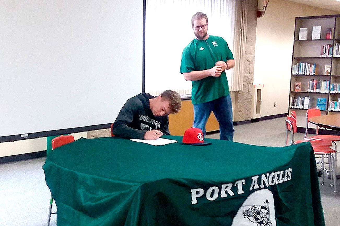 BASEBALL: Port Angeles catcher Joel Wood signs to play for Lower Columbia