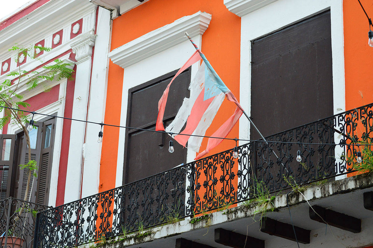 The Puerto Rican flag, though tattered, flies above Old San Juan. (Diane Urbani de la Paz/for Peninsula Daily News)