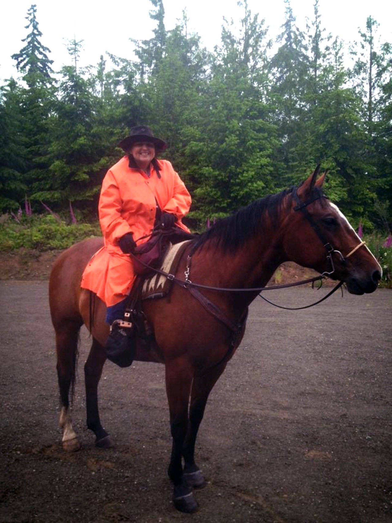 Karen Griffiths, riding Indy, head out on a rainy day to ride trails in the Cassidy Creek Department of Natural Resources. (Zorina Barker)