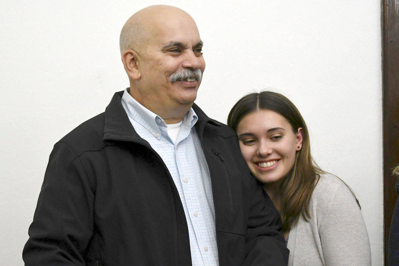 Jefferson County Sheriff-elect Joe Nole and his daughter learn of his election over incumbent Sheriff David Stanko on Tuesday night at the Jefferson County Courthouse. (Jeannie McMacken/Peninsula Daily News)
