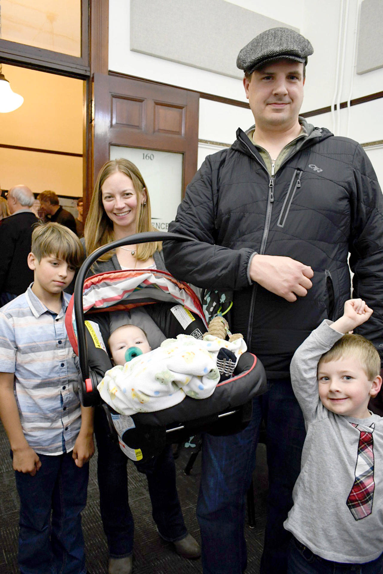 Jefferson County Prosecutor-elect James Kennedy, his wife Krystal and three sons — Sol, left, baby Miles and Collin, were present at the Jefferson County Courthouse on Tuesday night to learn he had defeated incumbent Michael Haas. (Jeannie McMacken/Peninsula Daily News)
