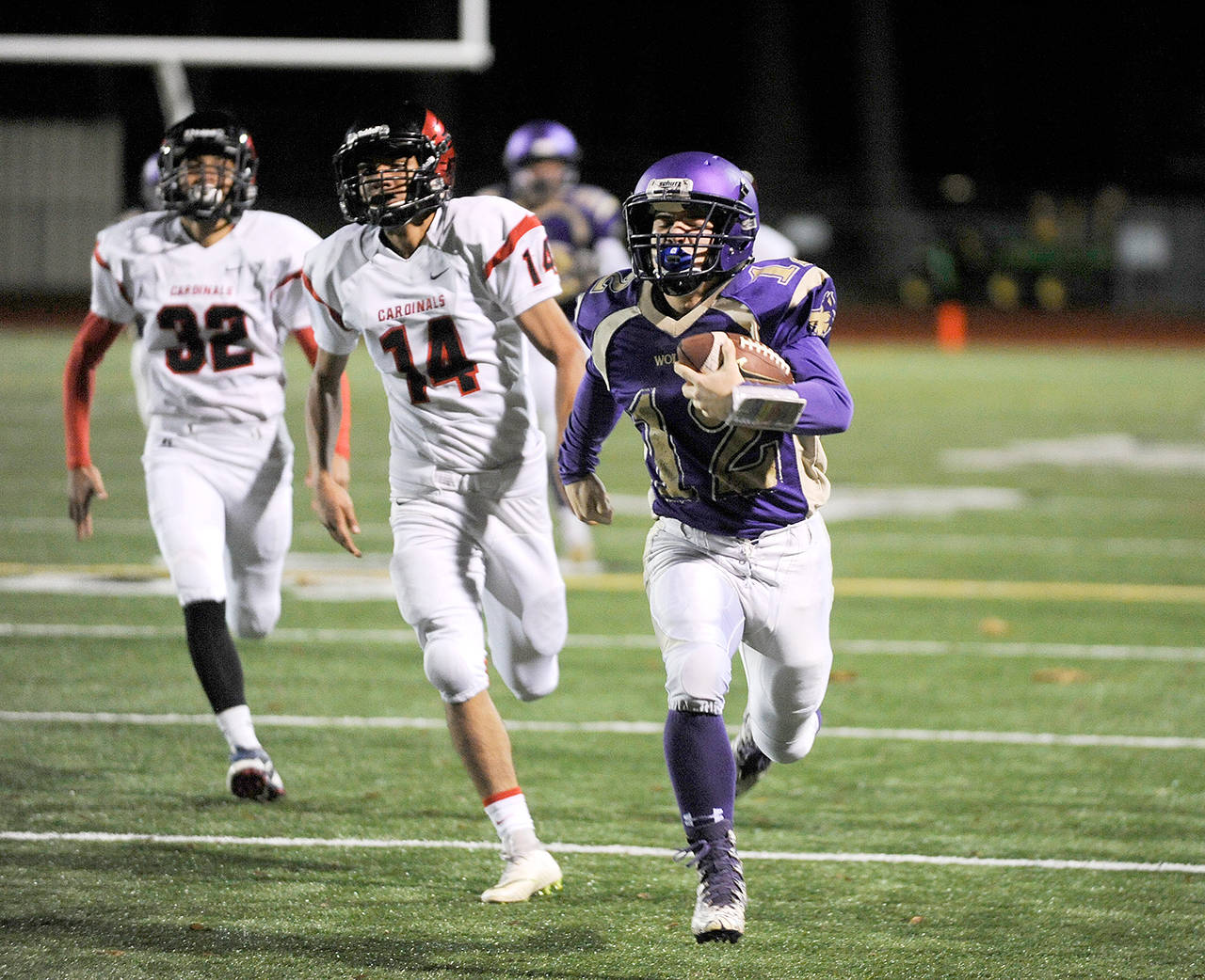 Michael Dashiell/Olympic Peninsula News Group Sequim’s Kyler Rollness makes a long gain during the Wolves’ win over Franklin Pierce last week.
