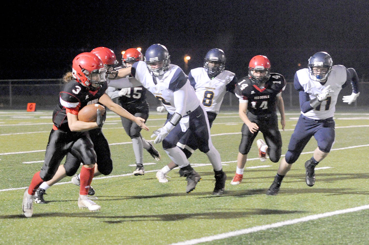 Lonnie Archibald/for Peninsula Daily News Neah Bay’s Toby Croy (3) returns the opening kickoff for a big gain in the Red Devils’ 56-30 Quad-District playoff win at Spartan Stadium in Forks on Friday.