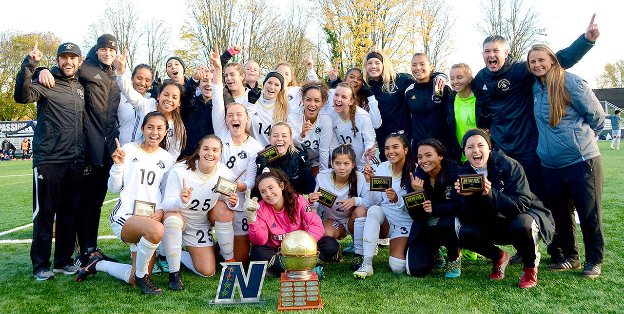 Jay Cline The Peninsula womens soccer team celebrates its fourth NWAC championship at the Starfire Soccer Complex in Tukwila on Sunday.